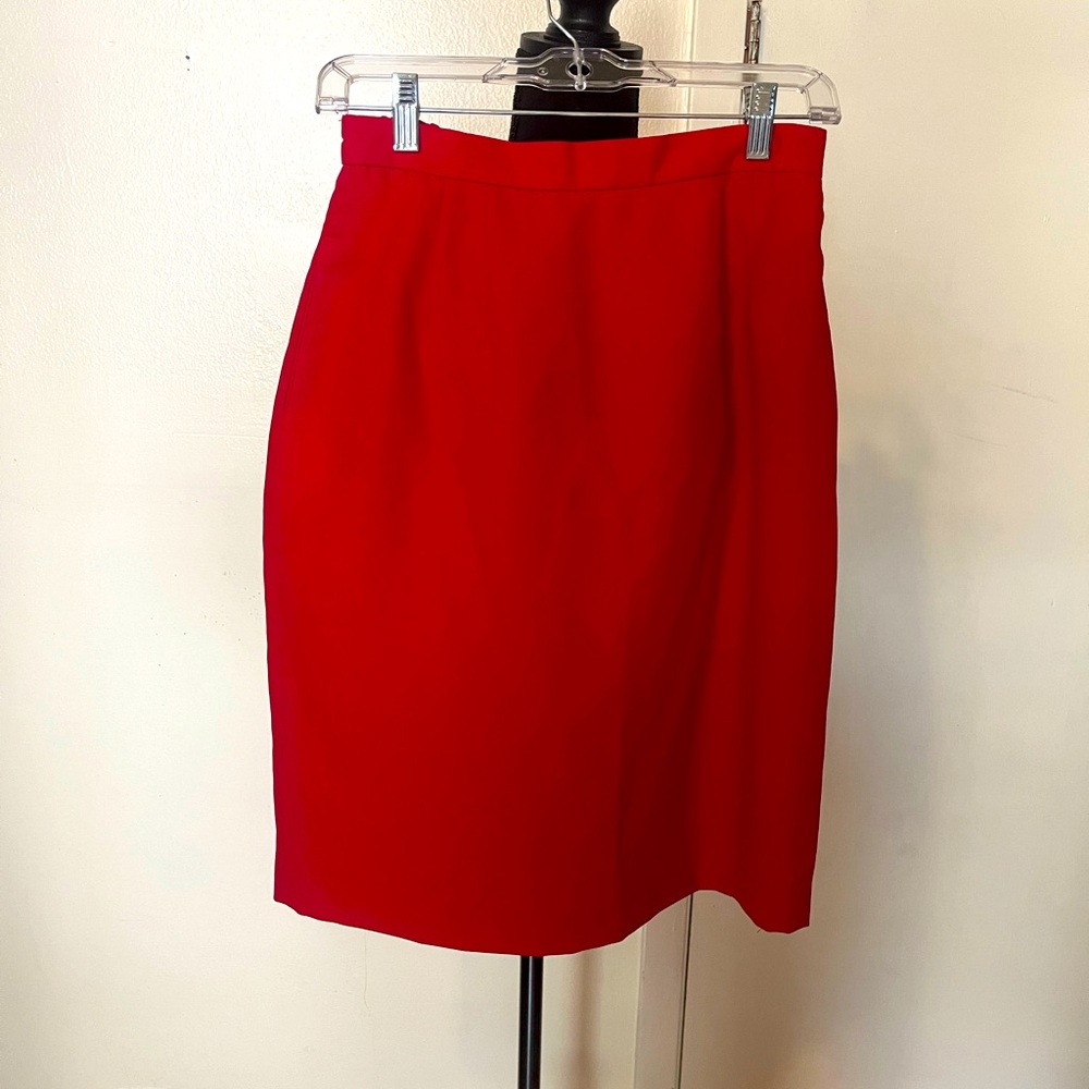 Red above-knee pencil skirt.